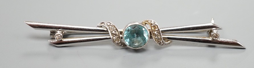 A 14ct white gold, blue zircon and diamond chip set bar brooch